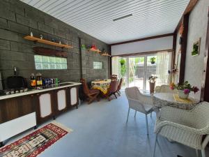 a kitchen with a table and chairs in a room at Casa Ana in Eforie Nord