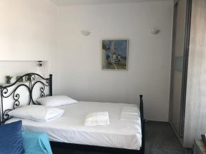 A bed or beds in a room at Iliovasilema VILLAGE