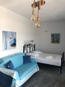 A bed or beds in a room at Iliovasilema VILLAGE