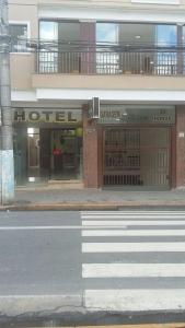a store front of a hotel on a city street at Vila Santa Hotel in Aparecida
