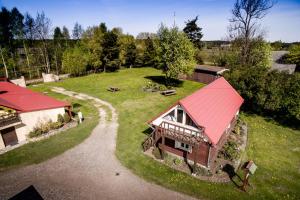 an aerial view of a house with a red roof at Kempings ĒRGĻI in Bernāti