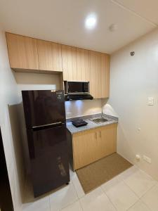 Kuchyň nebo kuchyňský kout v ubytování 2BR Condo in Banilad, Mandaue