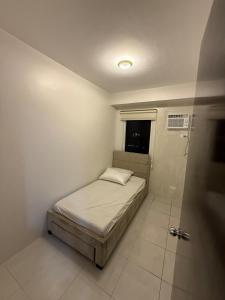 Postel nebo postele na pokoji v ubytování 2BR Condo in Banilad, Mandaue