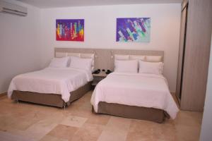Postel nebo postele na pokoji v ubytování Radisson Diamond Barranquilla