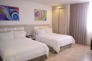 Postel nebo postele na pokoji v ubytování Radisson Diamond Barranquilla