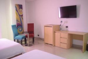 TV a/nebo společenská místnost v ubytování Radisson Diamond Barranquilla