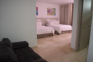 Postel nebo postele na pokoji v ubytování Radisson Diamond Barranquilla