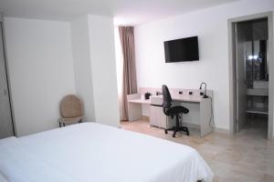 Postel nebo postele na pokoji v ubytování Radisson Diamond Barranquilla