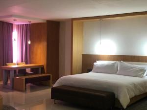 Postel nebo postele na pokoji v ubytování Radisson Diamond Barranquilla