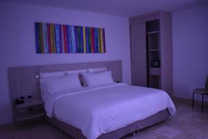 Postel nebo postele na pokoji v ubytování Radisson Diamond Barranquilla