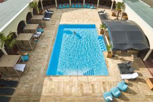 an overhead view of a swimming pool on a building at Wangerland Resort in Wangerland