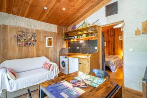 a living room with a couch and a table at La Poulido in Bédoin