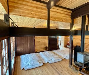Postel nebo postele na pokoji v ubytování くらし伊根大原