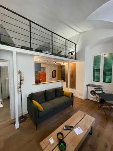a living room with a couch and a loft at Nid douillet - maison Spinola in Bastia
