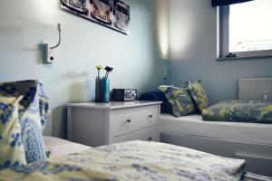 En eller flere senge i et værelse på Meerblick Lemkenhafen – Ferienwohnung