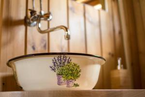 a bathroom sink with a potted plant in it at Koryciński wiatrak in Korycin