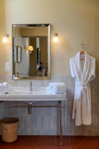 a bathroom with a sink and a mirror at Chateau Pascalette in La Londe-les-Maures