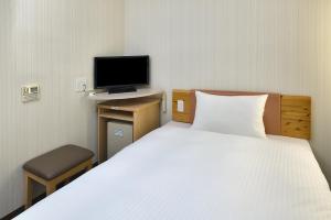 Letto o letti in una camera di washington R&B Hotel Kanazawa Station Nishiguchi