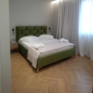 Postel nebo postele na pokoji v ubytování Hotel Parid