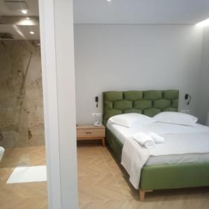 Postel nebo postele na pokoji v ubytování Hotel Parid