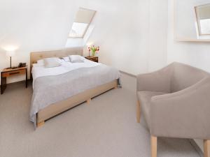Postel nebo postele na pokoji v ubytování Grottger Luxury Boutique Hotel City