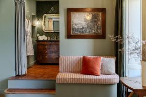 a living room with a couch and a mirror at Chateau Pascalette in La Londe-les-Maures +54 photos