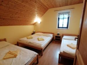 Postel nebo postele na pokoji v ubytování Chalupa Sluníčko