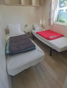 Postel nebo postele na pokoji v ubytování Camping Kersioual