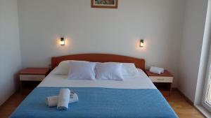 Кровать или кровати в номере Apartments & Room Marina View