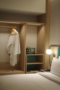 Postel nebo postele na pokoji v ubytování VIVERE Hotel, ARTOTEL Curated