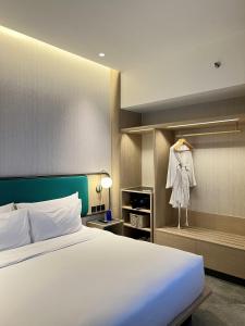 Postel nebo postele na pokoji v ubytování VIVERE Hotel, ARTOTEL Curated
