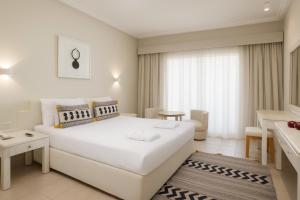 A bed or beds in a room at Sindbad Club