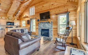 a living room with a couch and a fireplace at Lifes a Bear in Gatlinburg