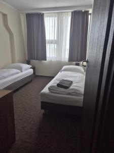 Posteľ alebo postele v izbe v ubytovaní Hotel Cargo
