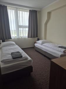 Posteľ alebo postele v izbe v ubytovaní Hotel Cargo