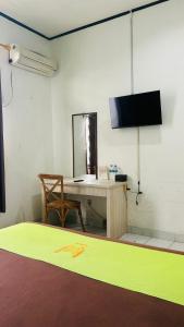 TV a/nebo společenská místnost v ubytování Hotel Huswah Airport