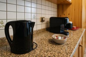 a coffee maker on a counter in a kitchen at Dimora i Laghi Tra Como, Lecco e Bellagio in Erba