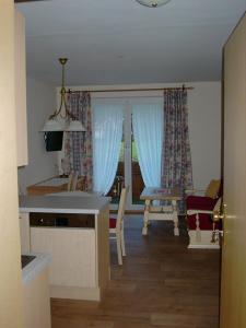 Televízia a/alebo spoločenská miestnosť v ubytovaní Anna's Appartements