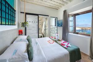 Postel nebo postele na pokoji v ubytování Lindos Vigli Private Villa