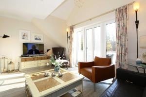 Televiisor ja/või meelelahutuskeskus majutusasutuses Haus Sterntaucher Whg 05 mit Balkon +25 fotot