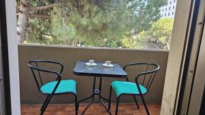 a table and chairs on a balcony with a window at appartamento di venezia in Venice