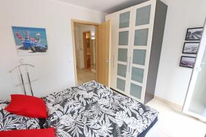 Ein Bett oder Betten in einem Zimmer der Unterkunft Villa Salus Whg 5 Auszeit - mit 2 Bädern und Balkon
