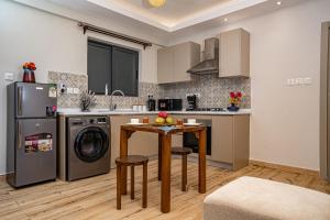 Kuchyň nebo kuchyňský kout v ubytování Elite One Bedroom Apartment,Swimming pool, gym, workspace ,Wonderiss Homes close proximity to GTC, JW Mariott and Kempinski