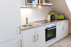 Kuchyň nebo kuchyňský kout v ubytování Haus Windrose Whg. 9 Seestern
