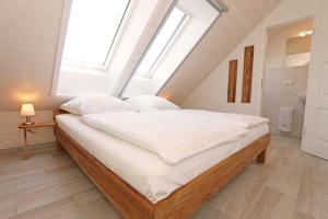 Postel nebo postele na pokoji v ubytování Haus Windrose Whg. 9 Seestern