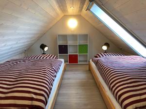 Postel nebo postele na pokoji v ubytování Haus Windrose Whg. 9 Seestern