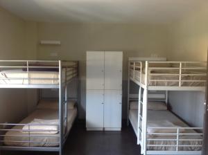 A bed or beds in a room at Albergue As Eiras