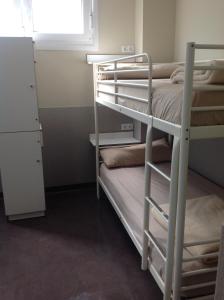A bed or beds in a room at Albergue As Eiras