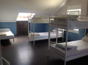 A bed or beds in a room at Albergue As Eiras