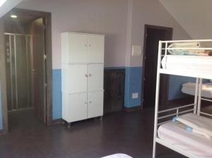 A bed or beds in a room at Albergue As Eiras